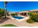 Landscaped backyard with pool, patio and lounge chairs, perfect for relaxing outdoors at 41961 W Centennial Rd, Maricopa, AZ 85138