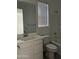 Bright bathroom with a tub/shower combo, white vanity, toilet, and a framed mirror at 4330 N 94Th Ave, Phoenix, AZ 85037