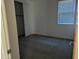 Cozy bedroom with plush carpeting, closet, and a window with blinds for privacy and natural light at 4330 N 94Th Ave, Phoenix, AZ 85037