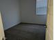 Simple bedroom features a neutral color scheme with a window at 4330 N 94Th Ave, Phoenix, AZ 85037