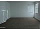 Large bedroom with carpet, white walls, and bright natural light from two windows at 4330 N 94Th Ave, Phoenix, AZ 85037