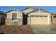Charming single-story home featuring stone accents, a two-car garage, and neat landscaping at 4330 N 94Th Ave, Phoenix, AZ 85037
