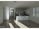 Open-concept living space showcases tile floors, recessed lighting, and a stylish kitchen with modern appliances at 4330 N 94Th Ave, Phoenix, AZ 85037