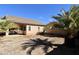 Backyard featuring desert landscaping and block walls at 44583 W Windrose Dr, Maricopa, AZ 85138
