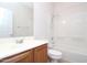 Bathroom featuring a shower and bathtub combo, toilet, and a vanity sink at 44583 W Windrose Dr, Maricopa, AZ 85138