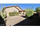 Low-maintenance backyard landscaping with desert foliage, decorative rock, and block wall at 45071 W Yucca Ln, Maricopa, AZ 85139
