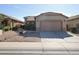 Charming single-story home featuring a well-maintained yard and two-car garage at 45071 W Yucca Ln, Maricopa, AZ 85139