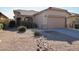 Beautiful single-story home featuring xeriscaping and a two-car garage at 45071 W Yucca Ln, Maricopa, AZ 85139
