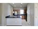 Bright and open kitchen featuring stainless steel appliances and an eat-in breakfast bar at 45071 W Yucca Ln, Maricopa, AZ 85139