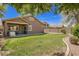 Spacious backyard with a covered patio and well-maintained landscaping at 4552 E County Down Dr, Chandler, AZ 85249