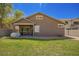 Large backyard featuring lush green grass and a covered patio at 4552 E County Down Dr, Chandler, AZ 85249