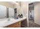 Bathroom with a well-lit vanity, ample counter space, and tile flooring at 4552 E County Down Dr, Chandler, AZ 85249