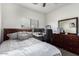 Comfortable bedroom featuring neutral colors, a bed, and a work desk area at 4552 E County Down Dr, Chandler, AZ 85249