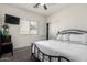 Comfortable bedroom with a metal-framed bed, plush carpet, and bright natural light at 4552 E County Down Dr, Chandler, AZ 85249