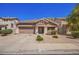 Charming single-story home featuring a well-manicured lawn, two-car garage and inviting entryway at 4552 E County Down Dr, Chandler, AZ 85249