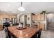 Spacious eat-in kitchen features tile flooring, a large table, and stainless steel appliances at 4552 E County Down Dr, Chandler, AZ 85249