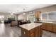 Bright kitchen features a center island, ample cabinetry, and a view into the living area at 4552 E County Down Dr, Chandler, AZ 85249