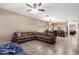 Cozy living room seamlessly connected to the kitchen, featuring a large sectional sofa for Gathering gatherings at 4552 E County Down Dr, Chandler, AZ 85249