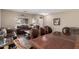 Cozy living room with stylish seating arrangement, dining table and ample natural light streaming through the windows at 4552 E County Down Dr, Chandler, AZ 85249