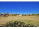 Expansive park with lush green grass and play structures, creating a vibrant community space at 4552 E County Down Dr, Chandler, AZ 85249