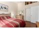 Bedroom with a comfortable bed, dresser, closet, and a ceiling fan creating a relaxing space at 45564 W Sheridan Rd, Maricopa, AZ 85139
