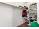 Spacious walk-in closet with ample storage space, including shelves and hanging racks at 45564 W Sheridan Rd, Maricopa, AZ 85139