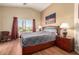 Serene main bedroom with vaulted ceilings and large windows filling the room with light at 45564 W Sheridan Rd, Maricopa, AZ 85139