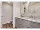 Modern bathroom featuring double sinks, gray vanity and new flooring at 4940 E Grandview St, Mesa, AZ 85205