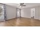Cozy bedroom with wood-like flooring and a ceiling fan, offering a comfortable retreat within the home at 4940 E Grandview St, Mesa, AZ 85205