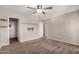 Bedroom features neutral carpet, closet with shelves, and ceiling fan at 4940 E Grandview St, Mesa, AZ 85205