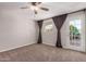 Bedroom boasts carpet, ceiling fan and door to outside at 4940 E Grandview St, Mesa, AZ 85205