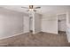 Bedroom featuring carpet, ceiling fan and closet at 4940 E Grandview St, Mesa, AZ 85205