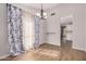 Bright dining room with modern chandelier, neutral color scheme and wooden floors at 4940 E Grandview St, Mesa, AZ 85205