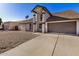 Charming home exterior with pillars, neutral color scheme, and a well-maintained front yard at 4940 E Grandview St, Mesa, AZ 85205