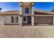 Charming home exterior with pillars, neutral color scheme, and a well-maintained front yard at 4940 E Grandview St, Mesa, AZ 85205