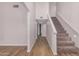 Bright hallway with wooden floors and a carpeted staircase leading to the upper level at 4940 E Grandview St, Mesa, AZ 85205