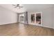 Bright living room featuring wood-like floors and French doors that bring the outside in for an airy feel at 4940 E Grandview St, Mesa, AZ 85205