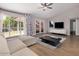 Bright living room with a large window, modern furniture, and hardwood floors at 4940 E Grandview St, Mesa, AZ 85205