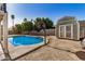 This backyard features a refreshing private pool, basketball court, and storage shed at 4940 E Grandview St, Mesa, AZ 85205
