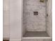 Modern bathroom shower features sleek gray tile flooring and marble tiled walls at 4940 E Grandview St, Mesa, AZ 85205