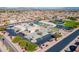 Wide aerial view of community showing tennis courts, pool, and well-maintained landscaping at 520 S Greenfield Rd # 22, Mesa, AZ 85206