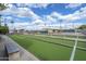 Beautifully maintained bocce ball court with comfortable seating and lush landscaping at 520 S Greenfield Rd # 22, Mesa, AZ 85206