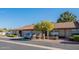 Charming home with brick exterior and desert landscaping under a clear blue sky at 520 S Greenfield Rd # 22, Mesa, AZ 85206