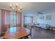 Open floor plan with hardwood floors, dining area, living room seating, and natural light filling the space at 520 S Greenfield Rd # 22, Mesa, AZ 85206