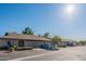 Street view of attractive homes with desert landscaping on a sunny day at 520 S Greenfield Rd # 22, Mesa, AZ 85206