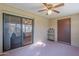 Spacious sunroom features a sliding glass door to the house and windows overlooking the yard and letting in natural light at 520 S Greenfield Rd # 22, Mesa, AZ 85206