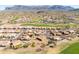 Breathtaking aerial view of the community, golf course, and mountains in the distance on a clear, sunny day at 5812 S Staghorn Cholla Ct, Gold Canyon, AZ 85118