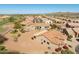Real estate showcasing a single-story home with a tile roof and desert landscaping within a golf course community at 5812 S Staghorn Cholla Ct, Gold Canyon, AZ 85118