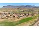 Wonderful aerial view of the community with golf course, and distant mountain views at 5812 S Staghorn Cholla Ct, Gold Canyon, AZ 85118