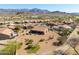 Real estate image featuring a single-story home with desert landscaping in a residential community near a golf course at 5812 S Staghorn Cholla Ct, Gold Canyon, AZ 85118
